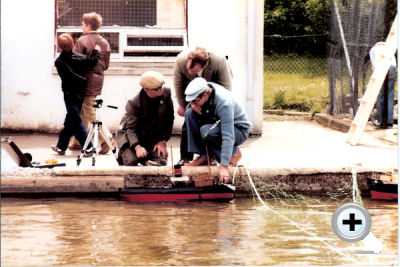 Discussion prior to photographing one of the model boats